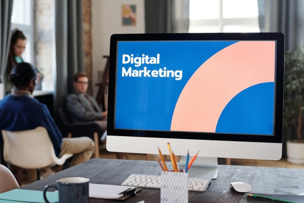 Monitor displaying Digital Marketing in workspace