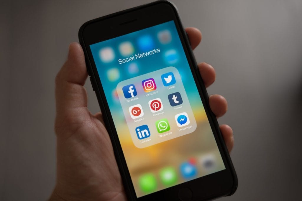 Phone displaying social media apps folder